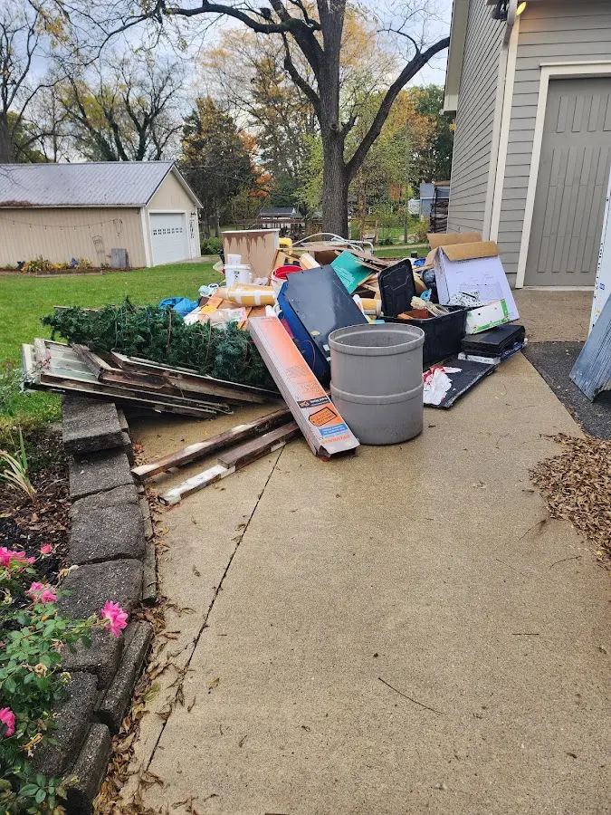 Dumpster being loaded with debris for Commercial Dumpster Rental in Portland